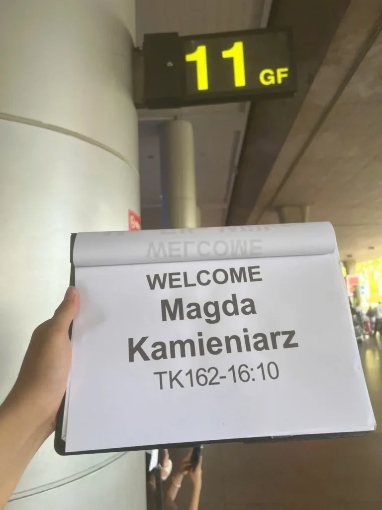 Driver waiting at Tan Son Nhat Airport with customer name sign